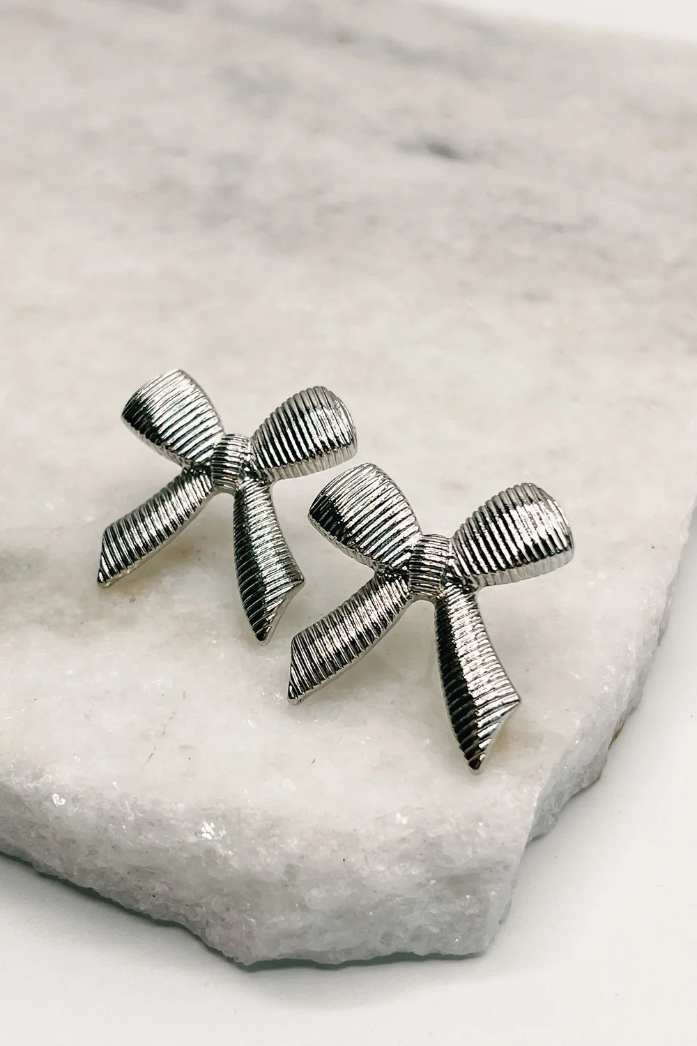 Emmie Silver Ribbed Bow Studs
