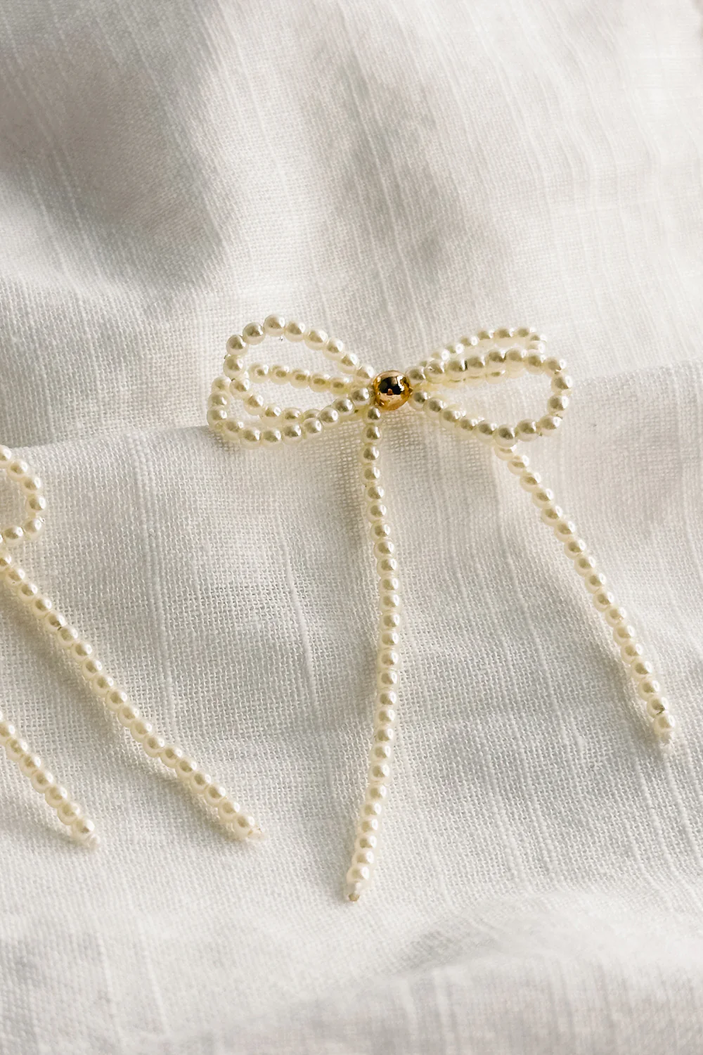 Tarah Cream Pearl Bow Dangle Earrings